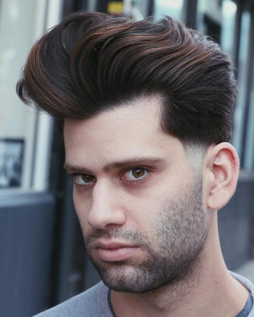 Thick Wavy Pompadour With Low Fade