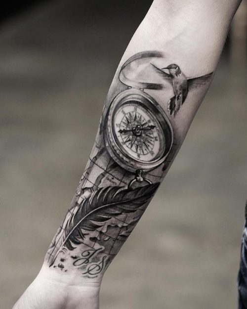 Gray Wash Tattoo With Nautical Compass, Feather And Hummingbird On Forearm 93