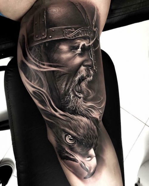 Realistic Viking Face With Eagle Head Tattoo On Biceps