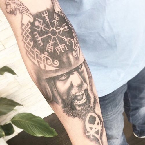 Viking Symbol And Roar Facial Tattoo On Forearm