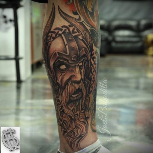Scary Viking Face Tattoo On Calf